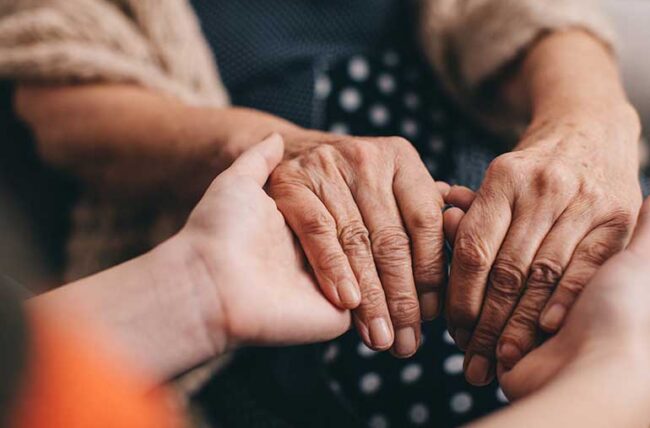 All hands together comforting during difficult times